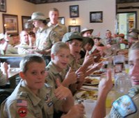 Group of boy scouts eating
